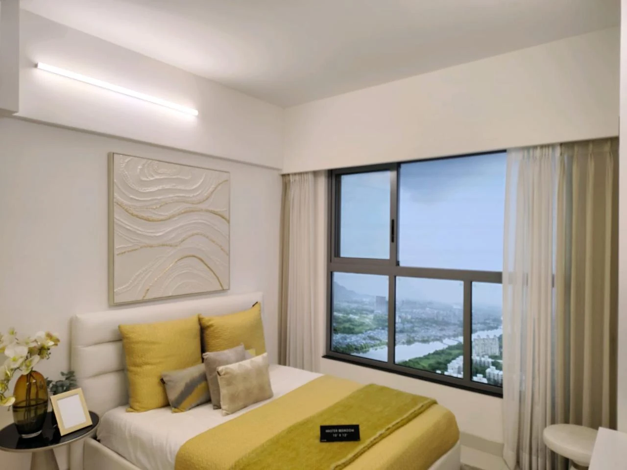 Urbania bedroom with yellow bedding and a large window