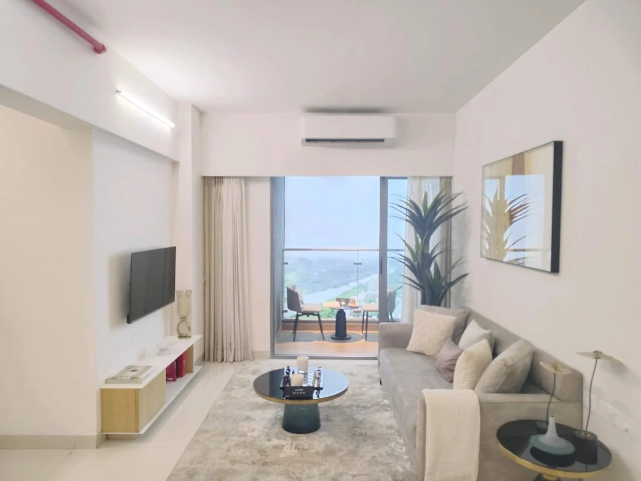 Urbania living room opening towards a balcony