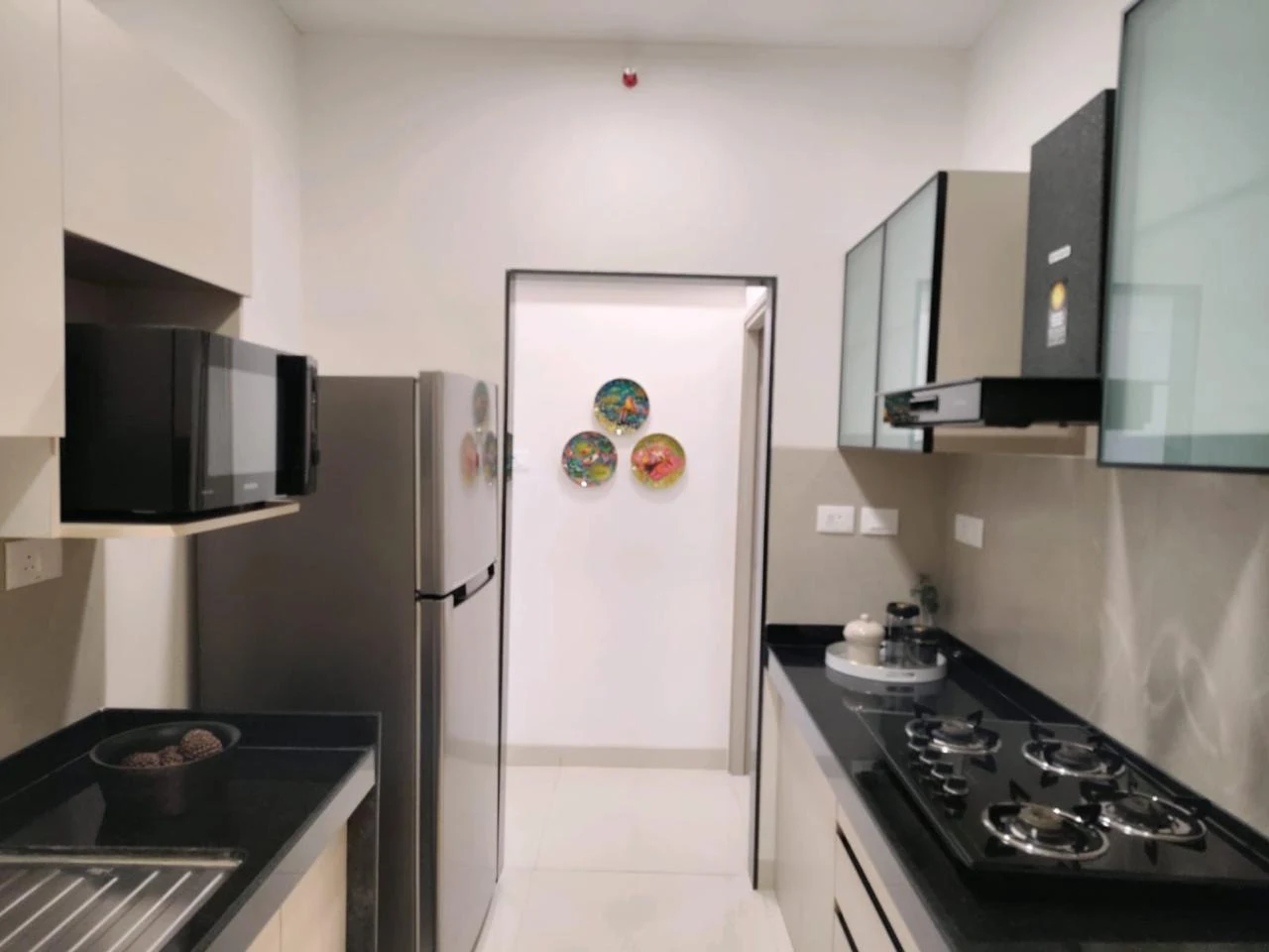 Urbania kitchen with parallel counters and upper cabinetry